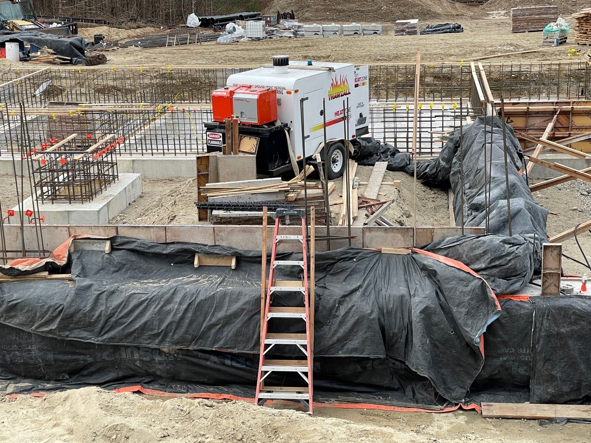 Concrete Placement with Heating Equipment and Insulation Blankets